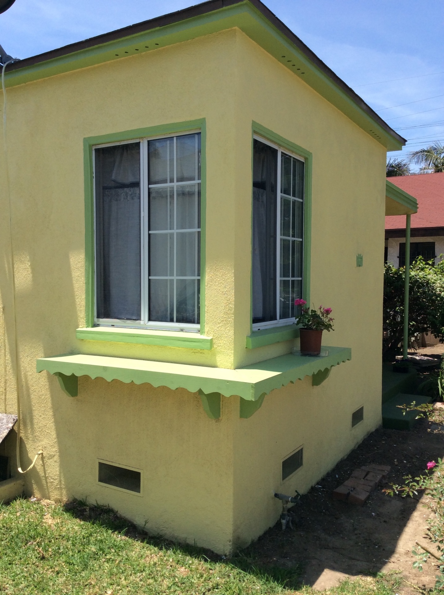 Failed stucco tear-off, new finish & trim paint in San Pedro — after