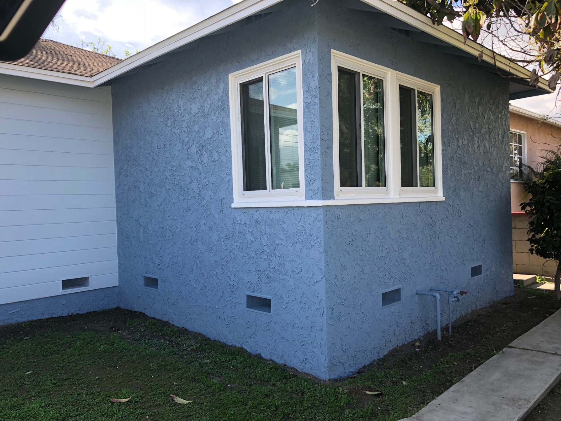 Re-stucco, retrofit windows, new sills in Torrance — after